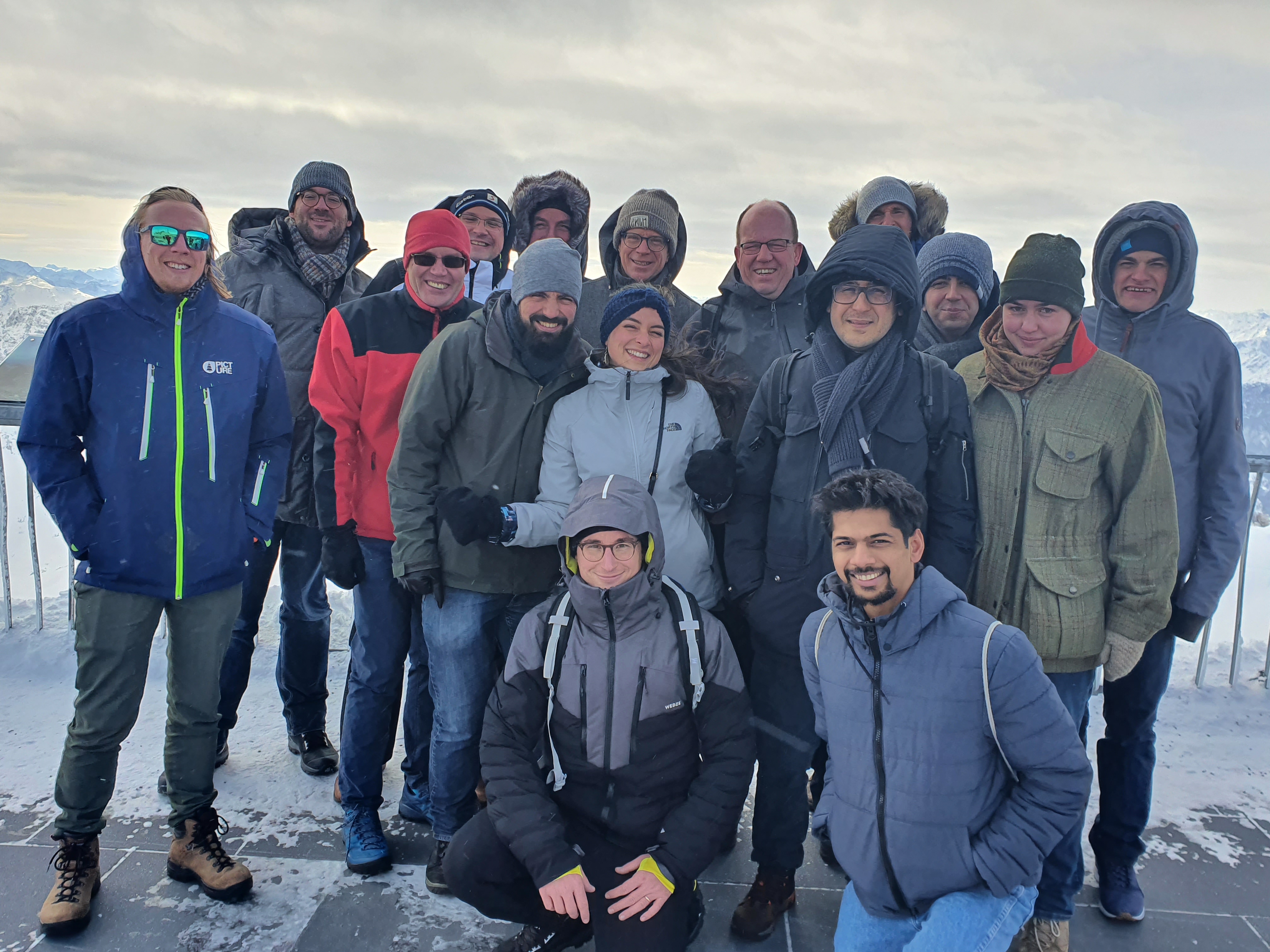 Part of the Research Unit FOR 2688 on top of the Zugspitze, trying 
	 to take a group photo with winds gusting up to 130 km/h